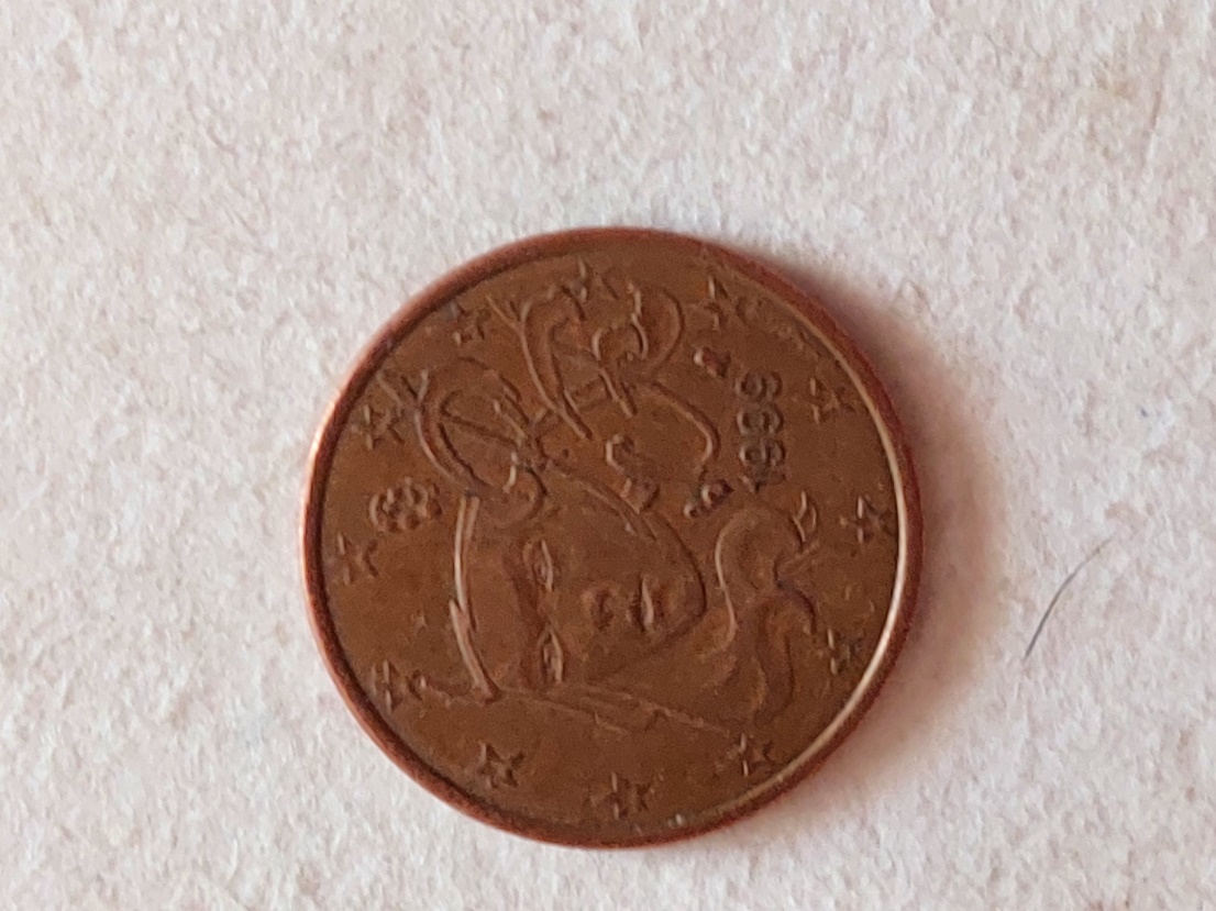 Une image contenant menthe, pièce, devise, argent

Description générée automatiquement